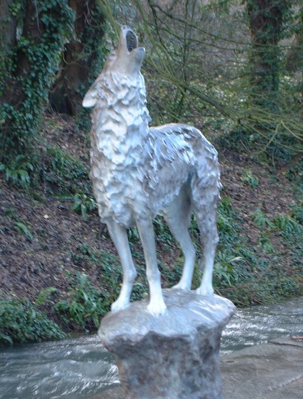 ‘Grey Wolf on a Rock (bronze standing Baying life size yard sculptures)’ by Gill Parker