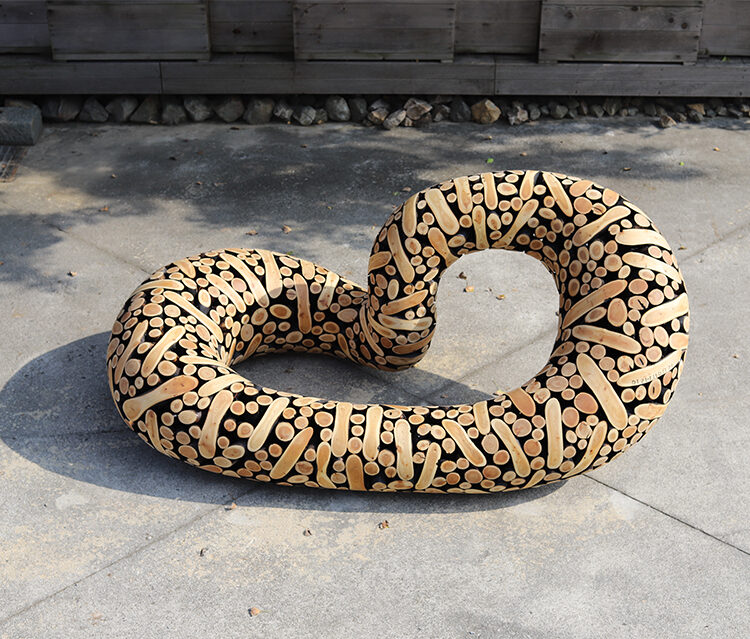 'SCULPTURE FROM AGED LOGS'